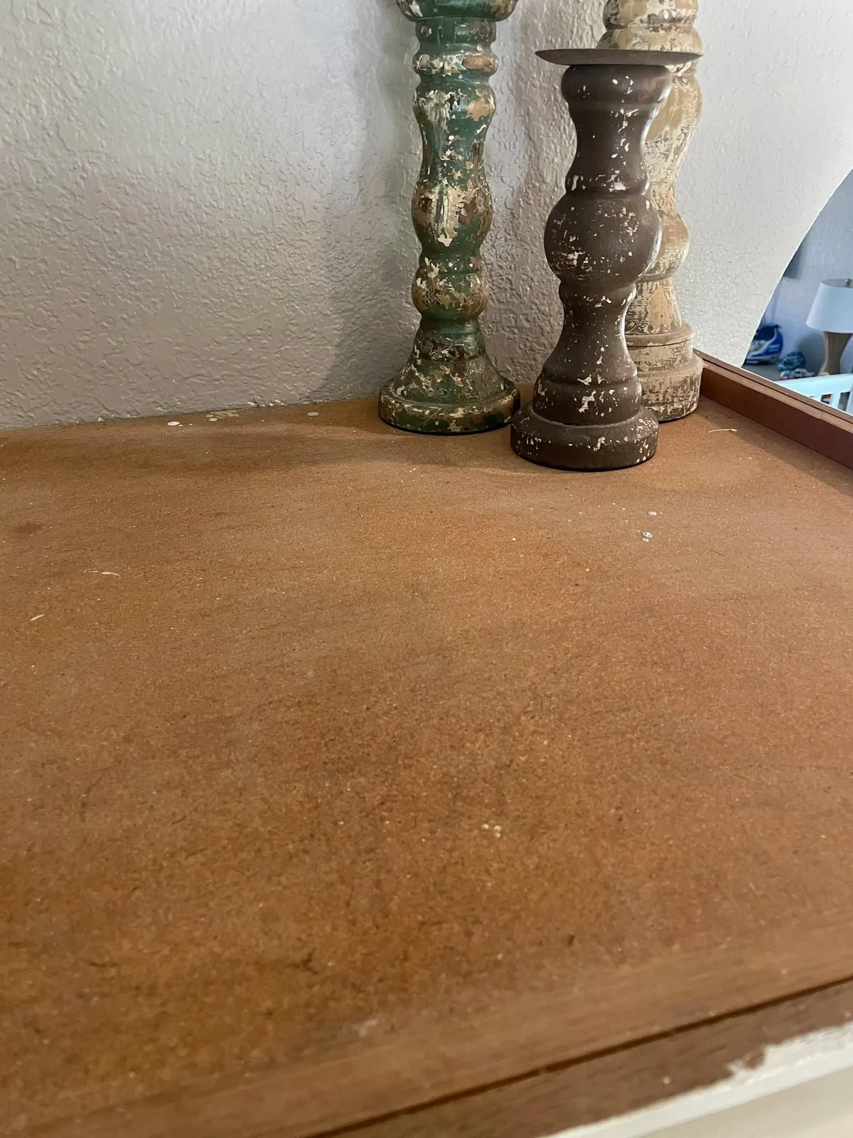 High cabinet surface with dust and debris before cleaning