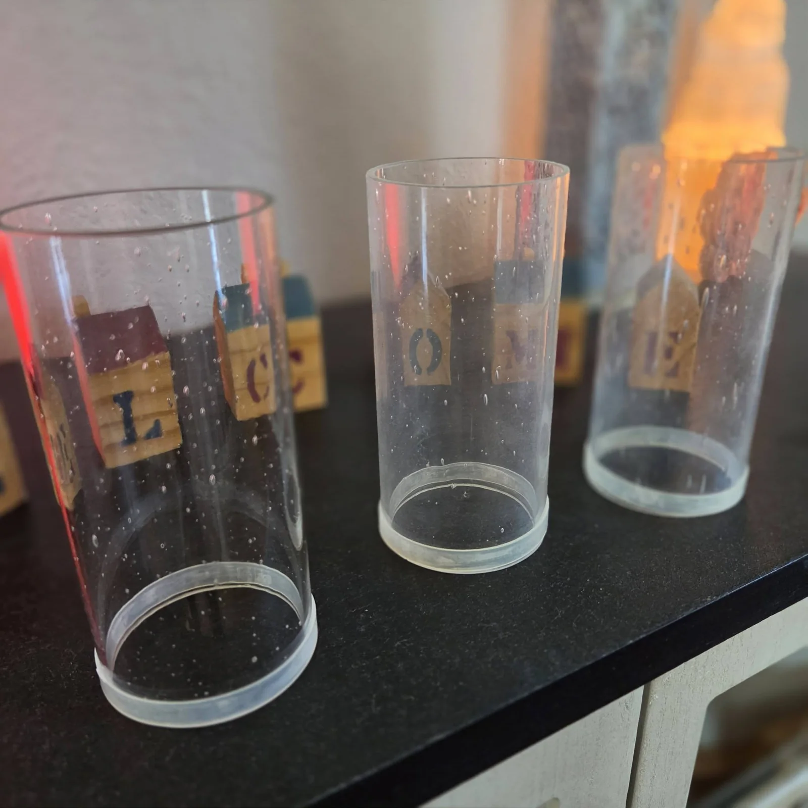 Close view of spotted glass cylinders before detail cleaning