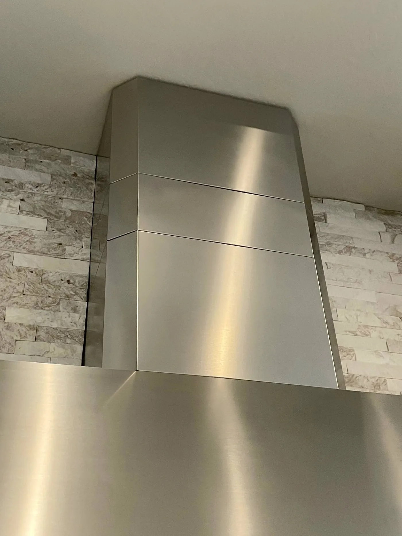 Finished stainless range hood detailed by Bloom and Broom