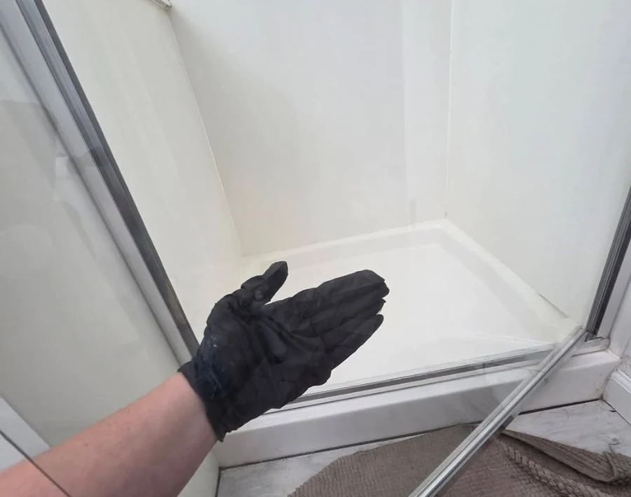 Clear shower glass after Bloom & Broom detail cleaning