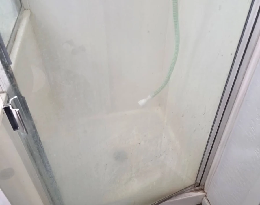 Cloudy shower before detailed cleaning